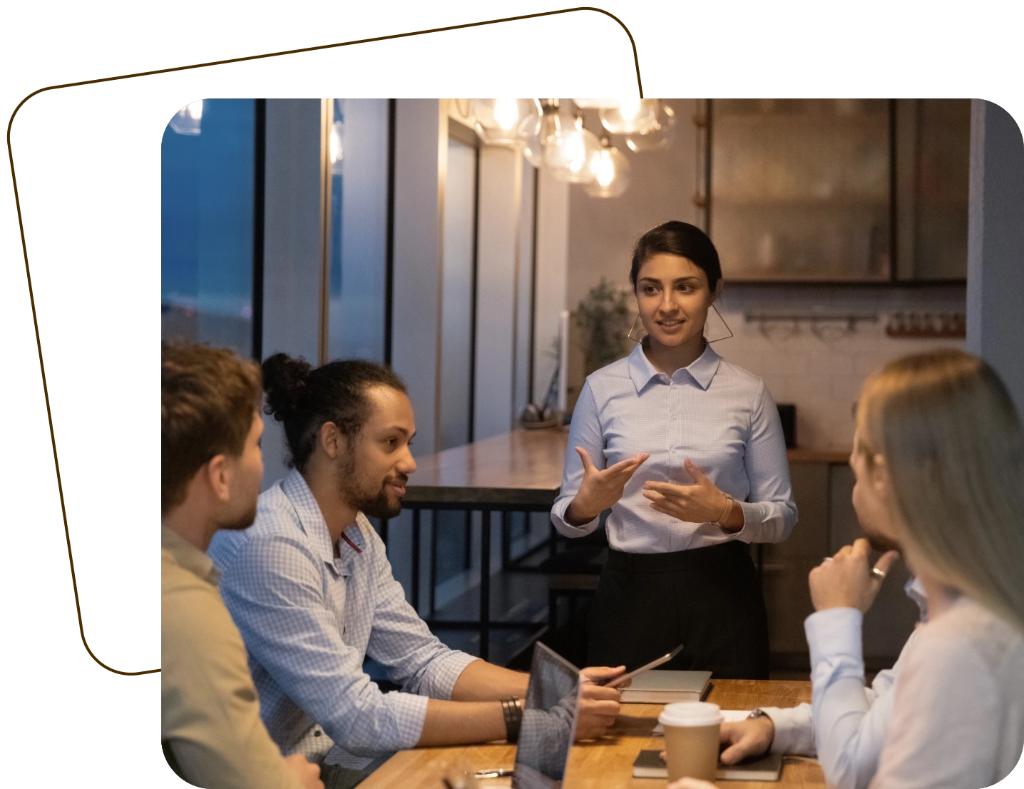 A group of people sitting around a table.